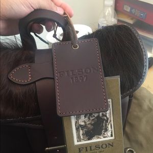 Filson leather waterproof bag